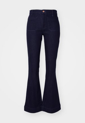 Jeans evazați din denim bleu închis, cu talie înaltă, două buzunare pe spate și detalii cusute pe cusături și tiv.