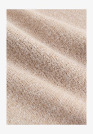 Beežikat värvi kootud kangas, millel on pehme ja karvane tekstuur; sellel on nüansirikas muster, kus lõnga paksus varieerub, näidates õrnaid lainetusi.