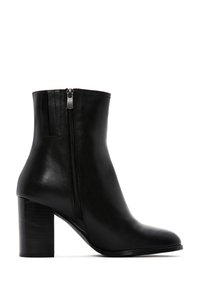 Black leather ankle boot with a smooth finish, tapered shape, and side zipper. Features a chunky, textured black heel.