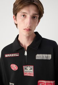 HUGO DANWYLL - Sudadera - black