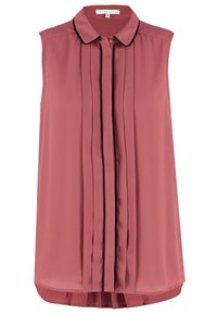 Blouse rose poudré sans manches avec un col bordé de noir et des plis verticaux courant le long du centre avant.