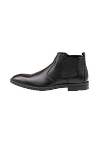 Bottine Chelsea en cuir noir avec une finition lisse, des panneaux élastiques sur les côtés, un bout pointu et une semelle robuste avec un accent rouge sur le talon.