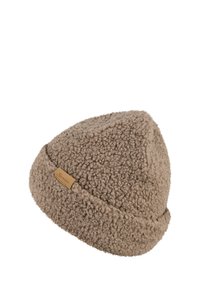Light brown sherpa fleece beanie with a folded brim and a small rectangular leather tag on the side.