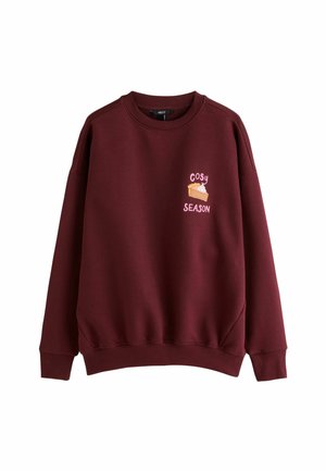 Bordeauxroter Sweatshirt mit Rundhalsausschnitt, mit einer kleinen Pie-Grafik und pinkem Text "Cosy Season" auf der linken Brustseite.