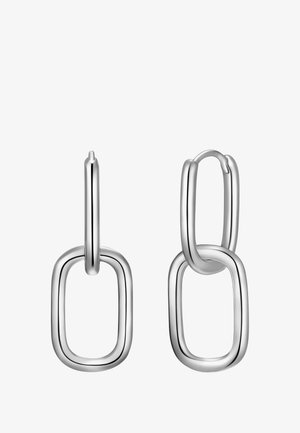 Pendientes de plata con una forma ovalada alargada, acentos rectangulares interconectados, acabado de metal pulido y textura suave.