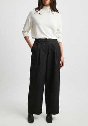 NA-KD FIGURBETONTE MIT MITTELHOHER TAILLE - Trousers - black