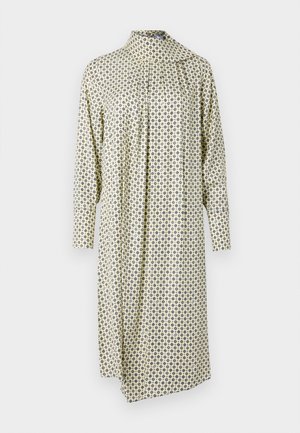 Patterned dress in light yellow fabric with diamond shapes in blue and brown. Features a high collar and long sleeves, with a relaxed fit.