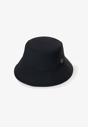 Black bucket hat made of smooth fabric, featuring a round crown and wide, downward-sloping brim. Includes a logo accent on the side.