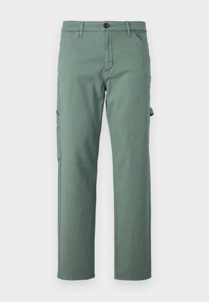 Green cargo pants made of durable fabric, featuring a straight leg design, side pockets, and a button closure. Smooth texture and minimalist style.