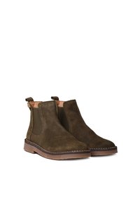 Brown suede ankle boots with elastic side panels, rounded toes, and a low profile tan rubber sole. Stitch detailing along the edges.