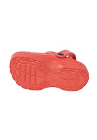 Red rubber sandal featuring a textured sole with grip patterns and an adjustable strap. Smooth finish with a rounded shape.