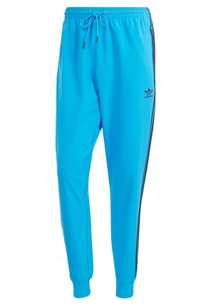 Pantalon de survêtement bleu clair en tissu léger avec une taille élastique, un cordon de serrage ajustable et des rayures noires sur les côtés.