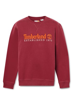 Burgundy sweatshirt made of cotton, featuring "Timberland ESTABLISHED 1973" in orange embroidered text. Ribbed cuffs and neckline.
