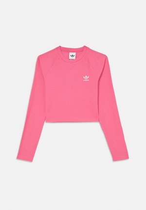 T-shirt court rose à manches longues Adidas avec col rond et petit logo blanc Adidas sur le devant, côté gauche de la poitrine.