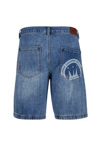 Denim shorts in light blue with a faded finish. Features two back pockets and a circular logo detail on the right pocket.