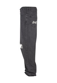 Grå denimjeans med en afslappet pasform, der har slidte huller, fem lommer og en frynset kant. Stoffet har en tekstureret overflade.