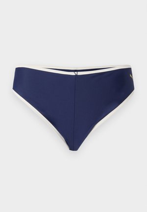 Slipuri bikini de culoare albastru închis, cu margini albe și un mic logo auriu Puma în partea dreaptă, expuse pe un fundal deschis simplu.