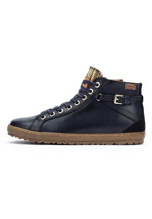 High-top sneakers in navy leather with a textured beige rubber sole, featuring gold eyelets, a side strap, and a patterned tongue.