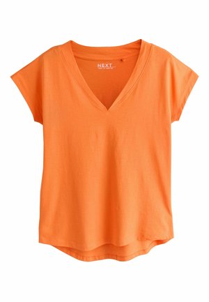 Lyhythihainen kirkkaan oranssi V-pääntie, jossa hieman kaareva helma, valmistettu pehmeästä puuvillakankaasta.