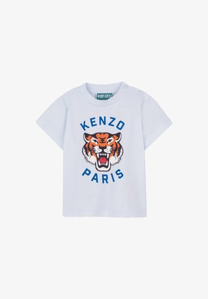 T-shirt en coton bleu clair présentant un graphisme central de tigre noir et orange avec "KENZO" au-dessus et "PARIS" en dessous en lettres bleues audacieuses.