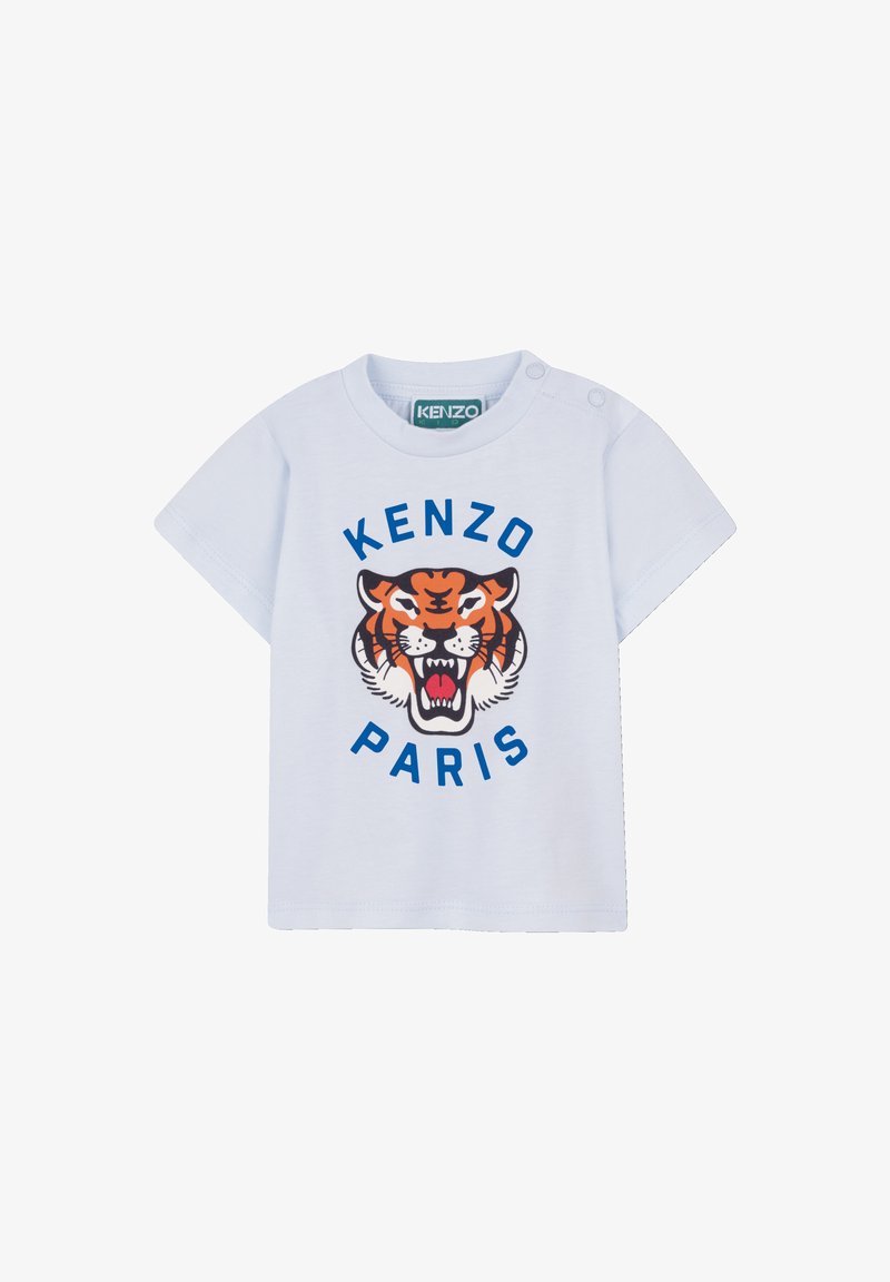 T-shirt en coton bleu clair présentant un graphisme central de tigre noir et orange avec "KENZO" au-dessus et "PARIS" en dessous en lettres bleues audacieuses.