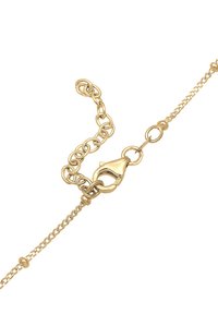 Bracciale in metallo dorato con chiusura, caratterizzato da anelli circolari intrecciati e un piccolo dettaglio pendente per la chiusura.
