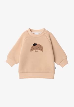 Beige Sweatshirt mit rundem Halsausschnitt und Raglanärmeln. Mit einem braunen Cartoon-Croissant mit einer schwarzen Baskenmütze und dem Text "Bonjour".