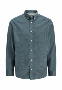 Kordfløyelskjorte i mørk teal, med knappelukking på kragen, lange ermer og en enkelt brystlomme. Teksturert stoff med vertikale striper.