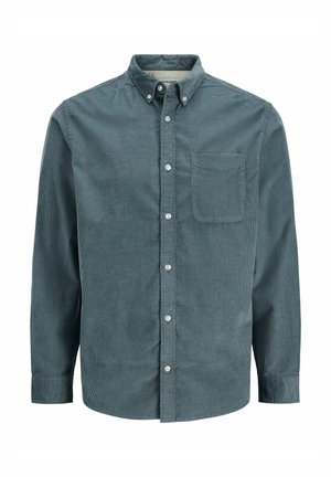 Košulja od manšestera u tamno tirkiznoj boji, s ovratnikom na kopčanje, dugim rukavima i jednim džepom na prsima. Teksturirani materijal s vertikalnim prugama.