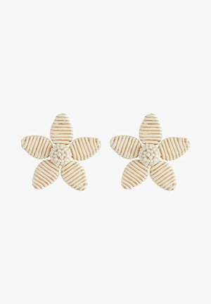 Flower-shaped earrings made of white material with gold stripes and a textured center, featuring five petals.