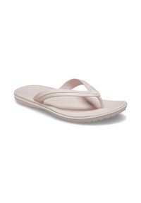 Sandales en caoutchouc de couleur rose clair avec deux larges brides et une semelle texturée pour une meilleure adhérence. Accent blanc autour de la semelle.