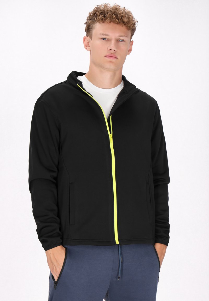 Zwarte zip-up hoodie met een voorrits in fel limoen groen, voorzien van een hoge kraag en zijzakken. Gladde stof met een relaxte pasvorm.