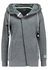Felpa grigia con zip, realizzata in tessuto morbido. Presenta un cappuccio interno decorato con un motivo a cuori, coulisse e tasche laterali.