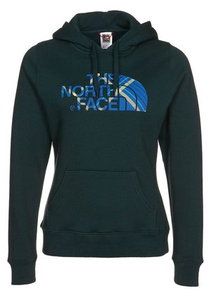 Sweat à capuche vert foncé avec poche avant et cordons, avec le logo "The North Face" en motif à carreaux bleu et jaune sur la poitrine.