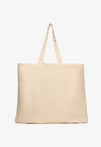 Beżowa torba na ramię z płótna, z dwoma uchwytami, prostokątna, o gładkim wzorze i miękkiej fakturze, odpowiednia do różnych zastosowań.