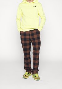 The North Face Jersey con capucha - yellow