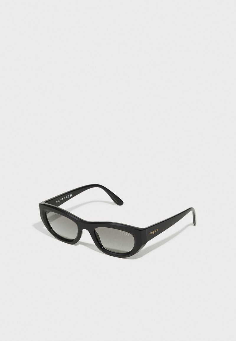 Black sunglasses with a sleek, rectangular frame. Equipped with dark gradient lenses and gold "vogue" branding on the temples.