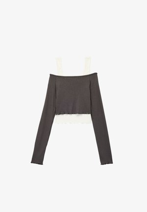 Off-the-shoulder ribbed top with long sleeves, features a dark gray body and contrasting light gray straps; cropped design with scalloped edges.