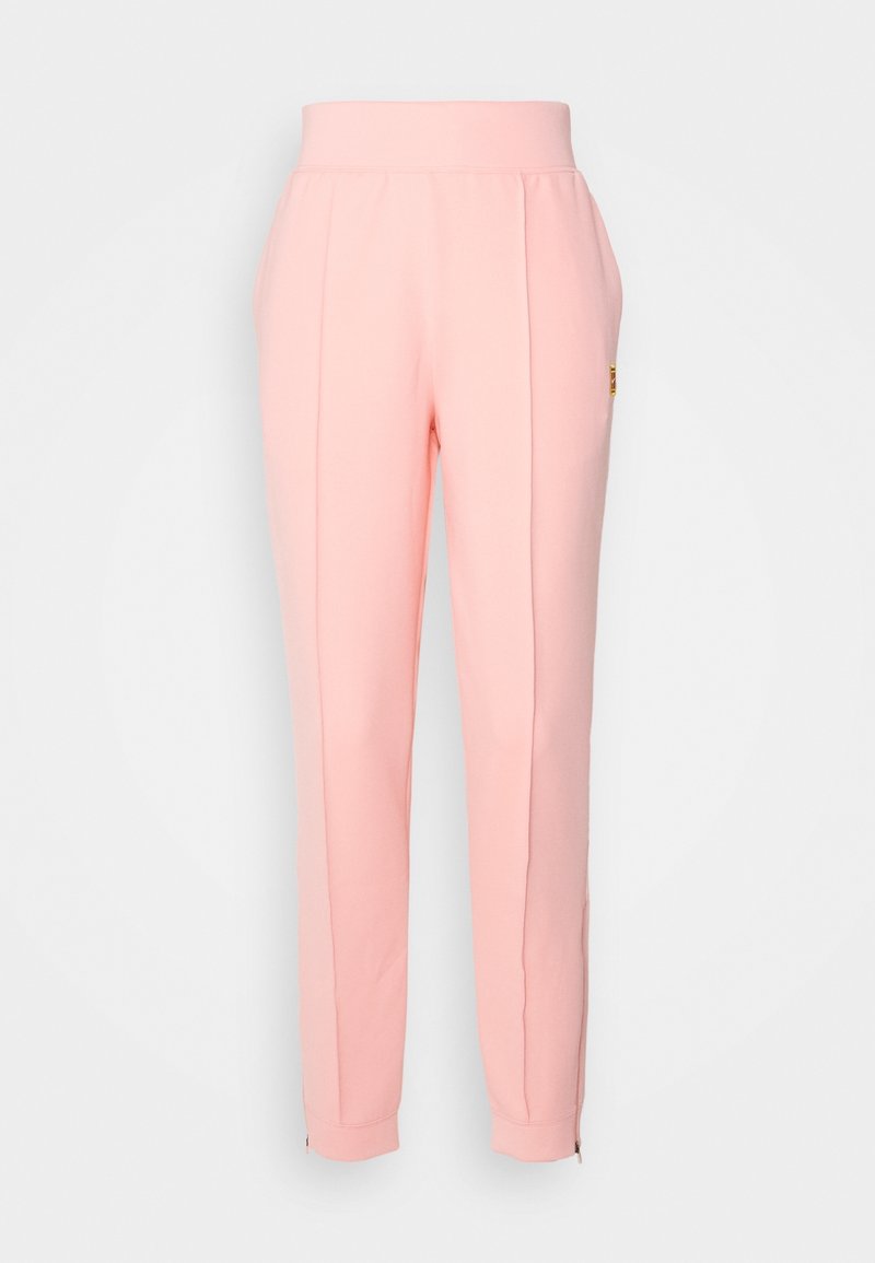 Rosa träningsoverallsbyxor med en bred elastisk midja, avsmalnande ben, sidosenor och dragkedjor vid anklarna. Tillverkade av ett mjukt, stretchigt material.