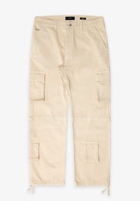 Beiga cargobyxor med flera sidofickor, knappstängning och justerbara ankle-ties. Mjuk bomullsmaterial med en slät yta.