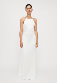 White, sleeveless dress with a halter neckline, floor-length design, subtle draping details, and smooth, shiny fabric texture.