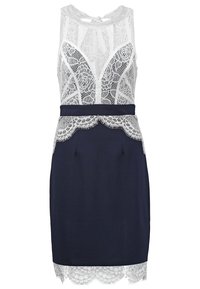 Robe bleu marine sans manches avec corsage en dentelle florale blanche, taille et ourlet, avec un col montant et un lien au dos en forme de trou de serrure.