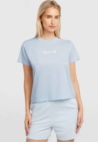 Light blue short-sleeve t-shirt with a round neckline, featuring a floral design and text printed on the chest. Soft cotton material.