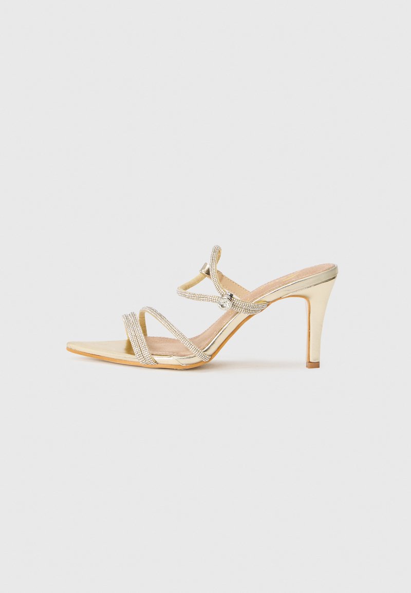 Cassis côte d’azur Muiltjes met hak goudkleurig Cassis côte d’azur Muiltjes met hak goudkleurig