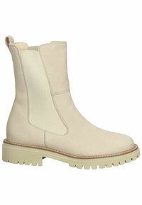 Bottine en cuir beige à panneaux latéraux élastiques, languette au talon, couture de welt et semelle crantée épaisse pour un usage en extérieur.