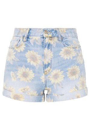Short en jean bleu clair avec bords retournés, fermeture éclair devant et imprimé floral de tournesols décolorés sur tout le tissu.