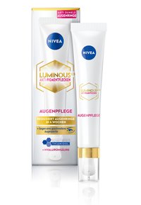 White tube with gold accents, featuring a pump dispenser. Packaging includes a box with blue and gold text, highlighting anti-pigment properties.