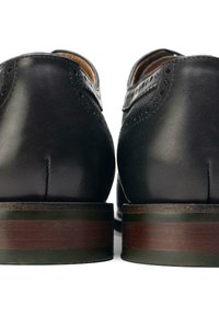 Black leather shoes with a smooth finish, featuring brogue detailing, rounded heels with contrasting wood accents, and a sleek design.