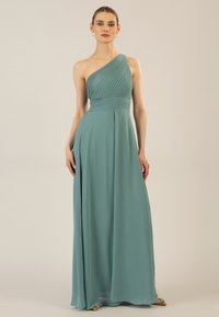 Einfallsreiches Ein-Shoulder-Kleid in Teal, mit plissiertem Oberteil und fließendem Rock. Hergestellt aus leichtem Stoff mit einer eleganten, glatten Textur.