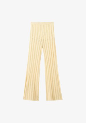 Cream-colored knitted trousers with vertical striped open-knit pattern and wide flared legs.